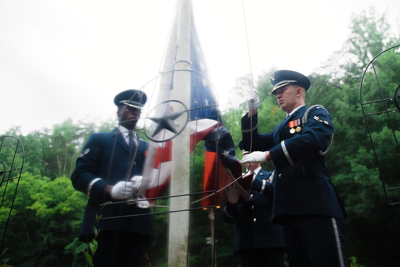Members of the U.S. Air Force Honor Guard perform a flag raising ceremony at the Dollywood theme park in Pigeon Forge, Tenn., July 4, 2017. The ceremony provided an opportunity for the honor guard to honor veterans and inspire patriotism while showcasing the Air Force mission. (U.S. Air Force photo by Senior Airman Delano Scott)