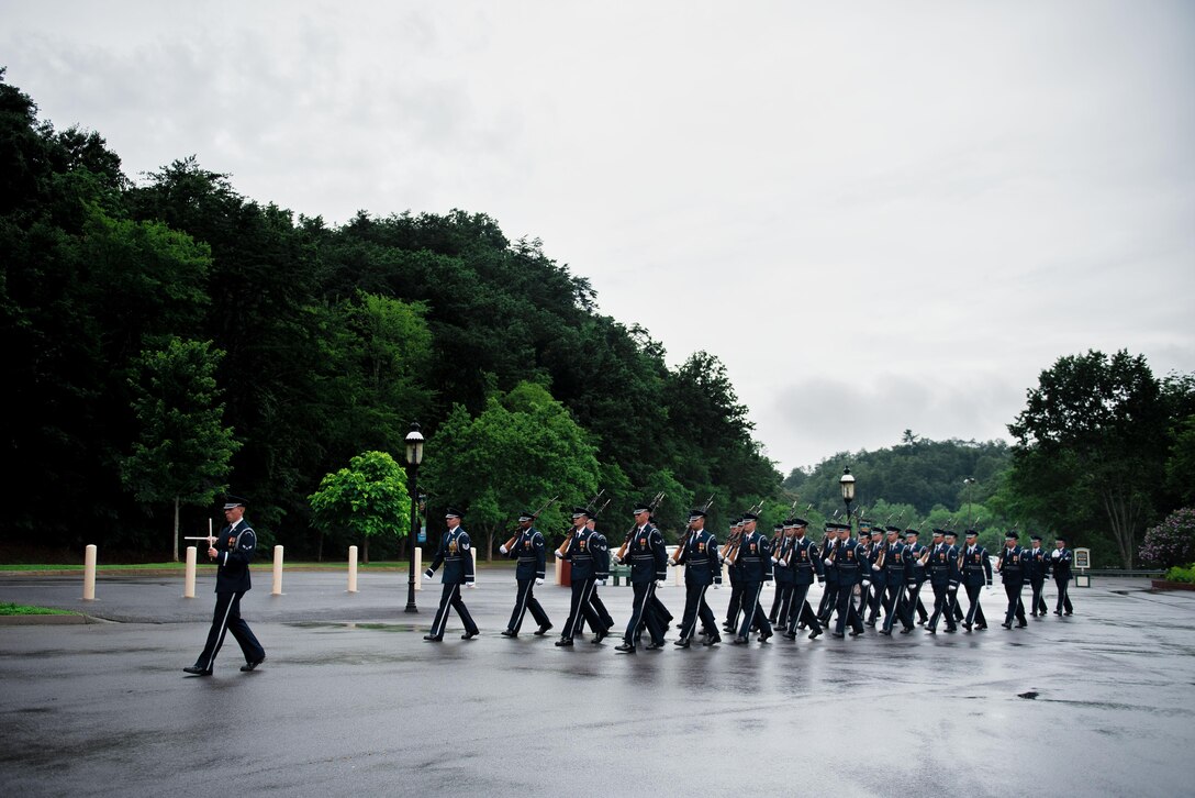 The U.S. Air Force Honor Guard prepare to perform a flag raising ceremony at the Dollywood theme park in Pigeon Forge, Tenn., July 4, 2017. The ceremony provided an opportunity for the honor guard to honor veterans and inspire patriotism while showcasing the Air Force mission. (U.S. Air Force photo by Senior Airman Delano Scott)