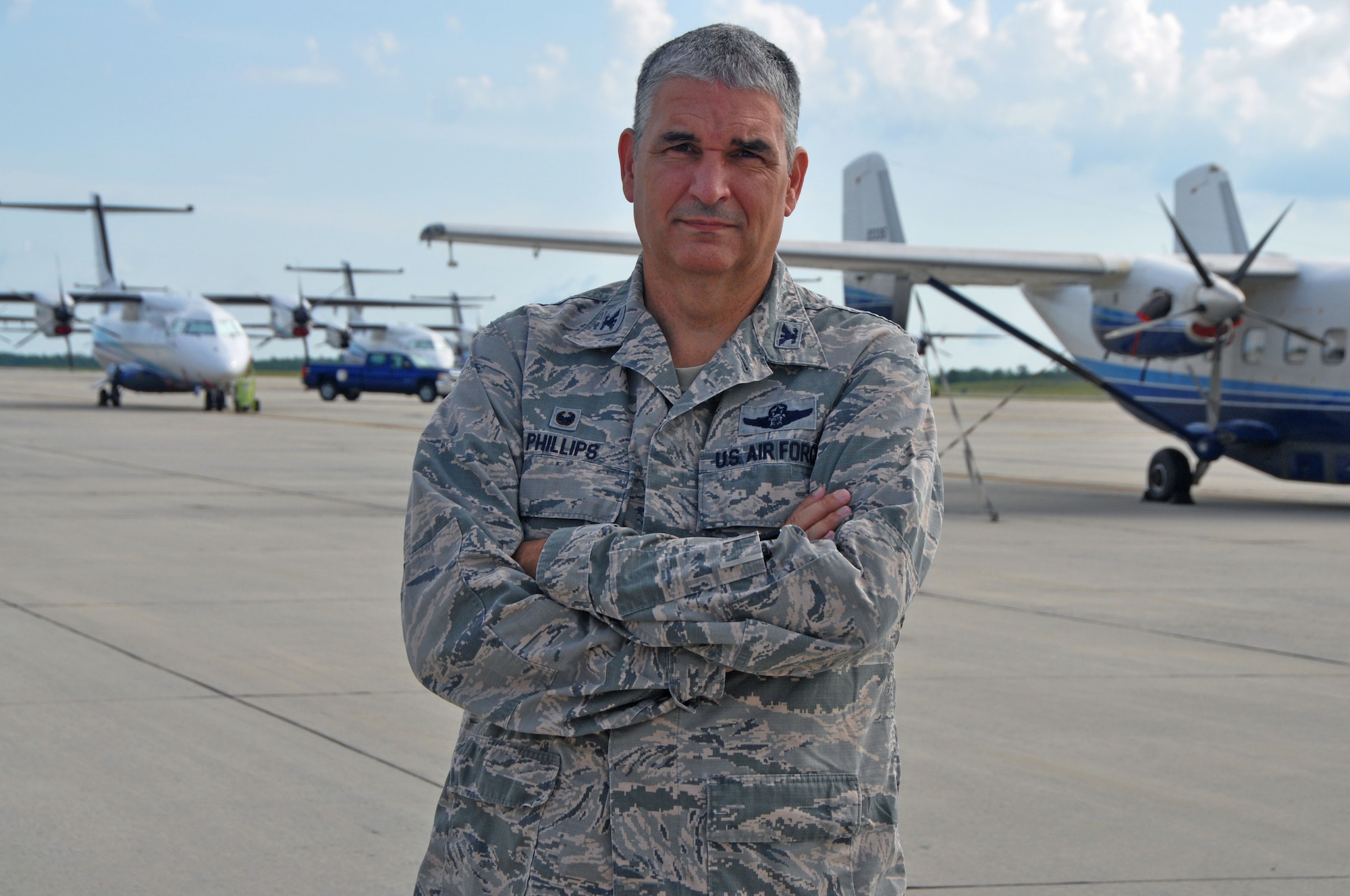 Col. James Phillips poses for a photo on the Duke Field, Florida, flightline July 8 during his final day as 919th Special Operations Wing commander. Phillips is moving to Robins Air Force Base, Georgia, where he will serve as the Director of Plans and Programs, Air Force Reserve Command. (U.S. Air Force photo/Dan Neely)