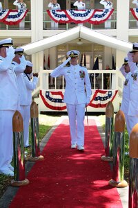 Capt. Greg Burton departs the change of command ceremony at which he relieved Capt. Jamie Kalowsky as the 47th commanding officer of Pearl Harbor Naval Shipyard and Intermediate Maintenance Facility.  The change of command took place in front of the Shipyard Headquarters Building on Friday, July 7, 2017