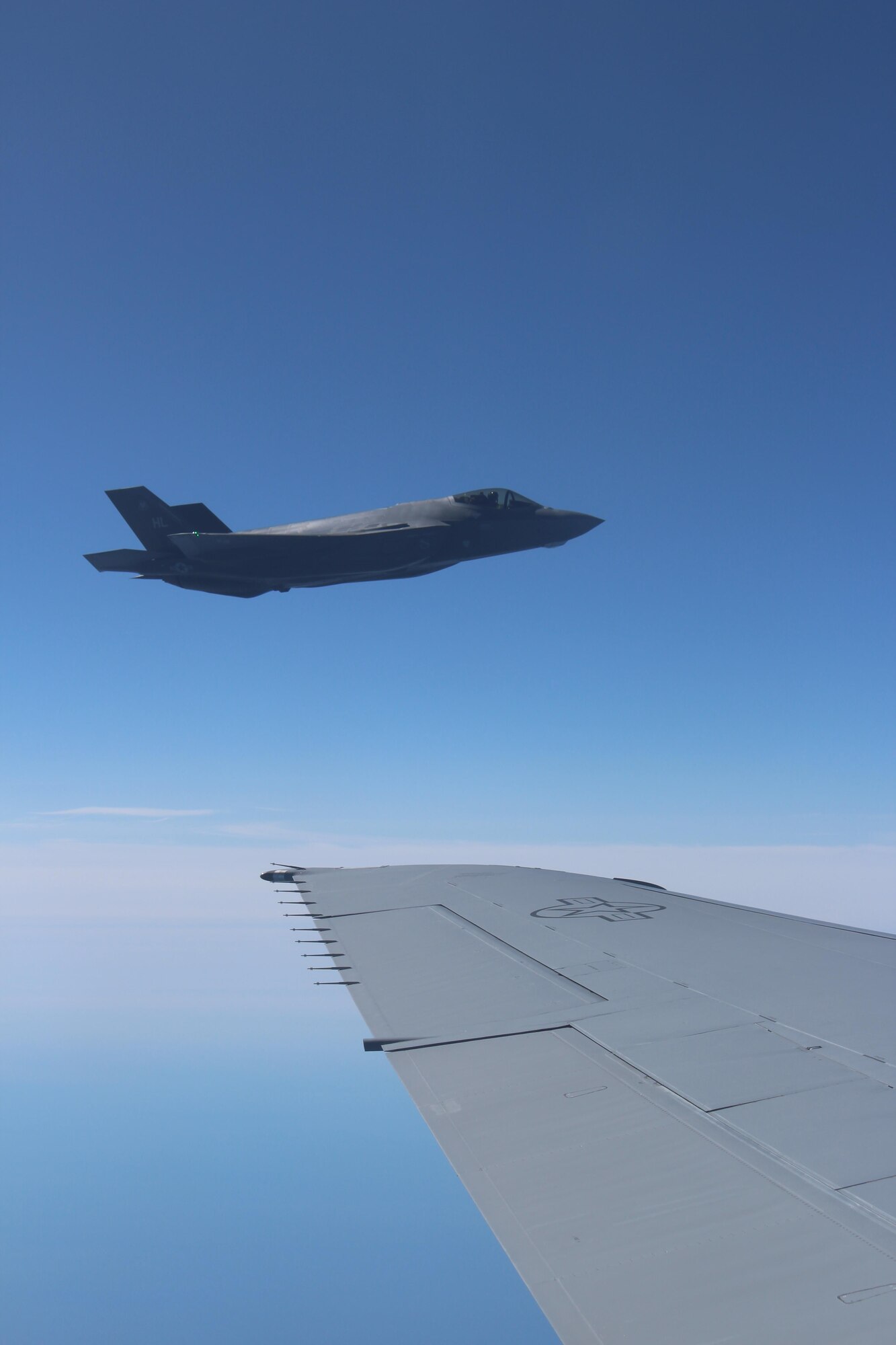 An F-35 fighter jet stays close to its fuel source.