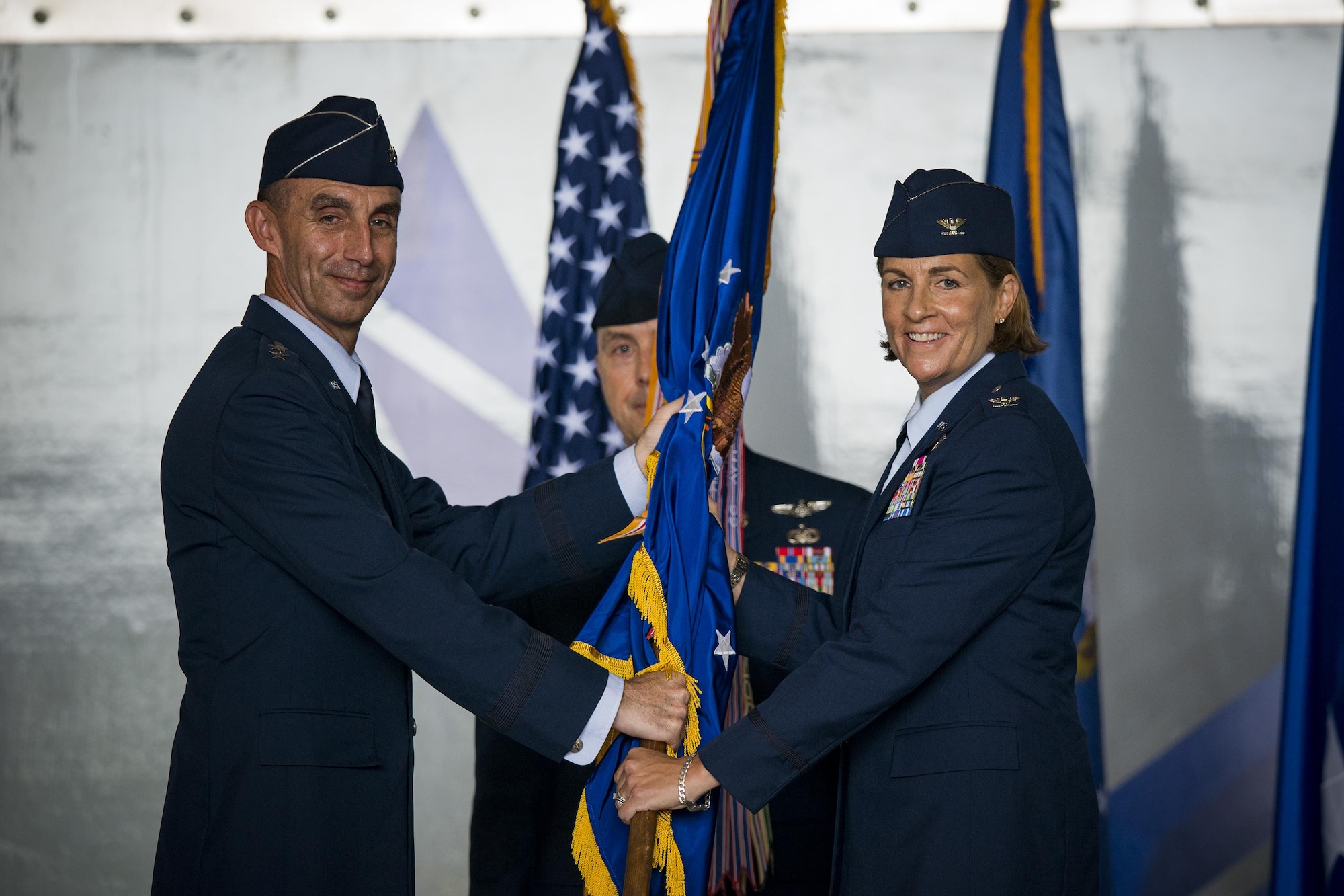 U.S. Air Force Maj. Gen. Scott J. Zobrist (left), 9th Air Force commander, hands the 23d Wing guideon to Col. Jennifer Short, 23d Wing commander, during a change of command ceremony, July 10, 2017, at Moody Air Force Base, Ga. Short is a senior pilot with more than 1,800 hours flying A-10 and trainer aircraft, and before becoming a pilot, served as a C-130 Navigator. (U.S. Air Force photo by Staff Sgt. Ryan Callaghan)