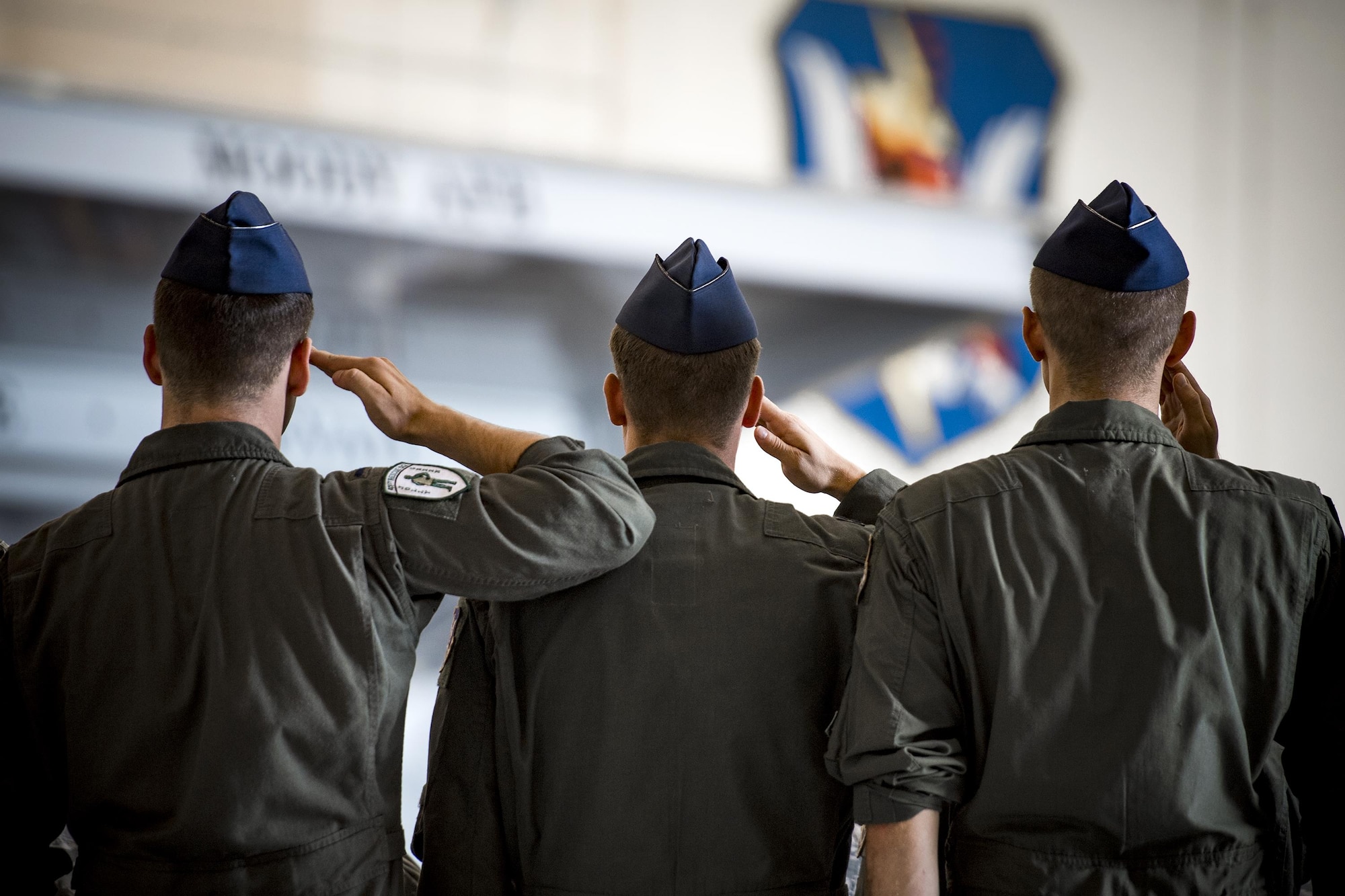 Airmen from the 41st Rescue Squadron salute during a change of command ceremony, July 10, 2017, at Moody Air Force Base, Ga. The change of command ceremony is a part of military history signifying the hand-off of responsibility of a unit from one commander to another. (U.S. Air Force photo by Staff Sgt. Ryan Callaghan)