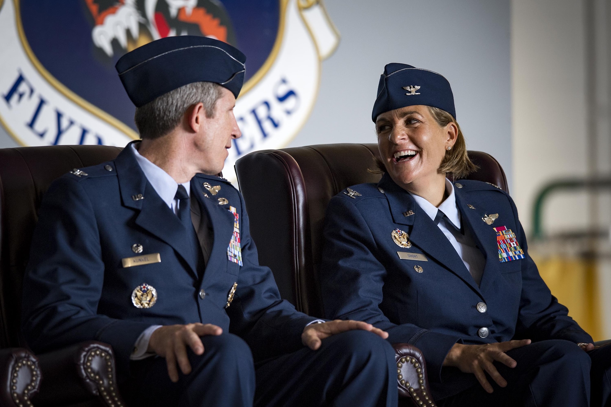 Col. Jennifer Short, right, 23d Wing commander, shares a laugh with Col. Thomas Kunkel, outgoing 23d Wing commander, during a change of command ceremony, July 10, 2017, at Moody Air Force Base, Ga. Short is a senior pilot with more than 1,800 hours flying A-10 and trainer aircraft, and before becoming a pilot, she served as a C-130E Hercules Navigator. (U.S. Air Force photo by Staff Sgt. Ryan Callaghan)