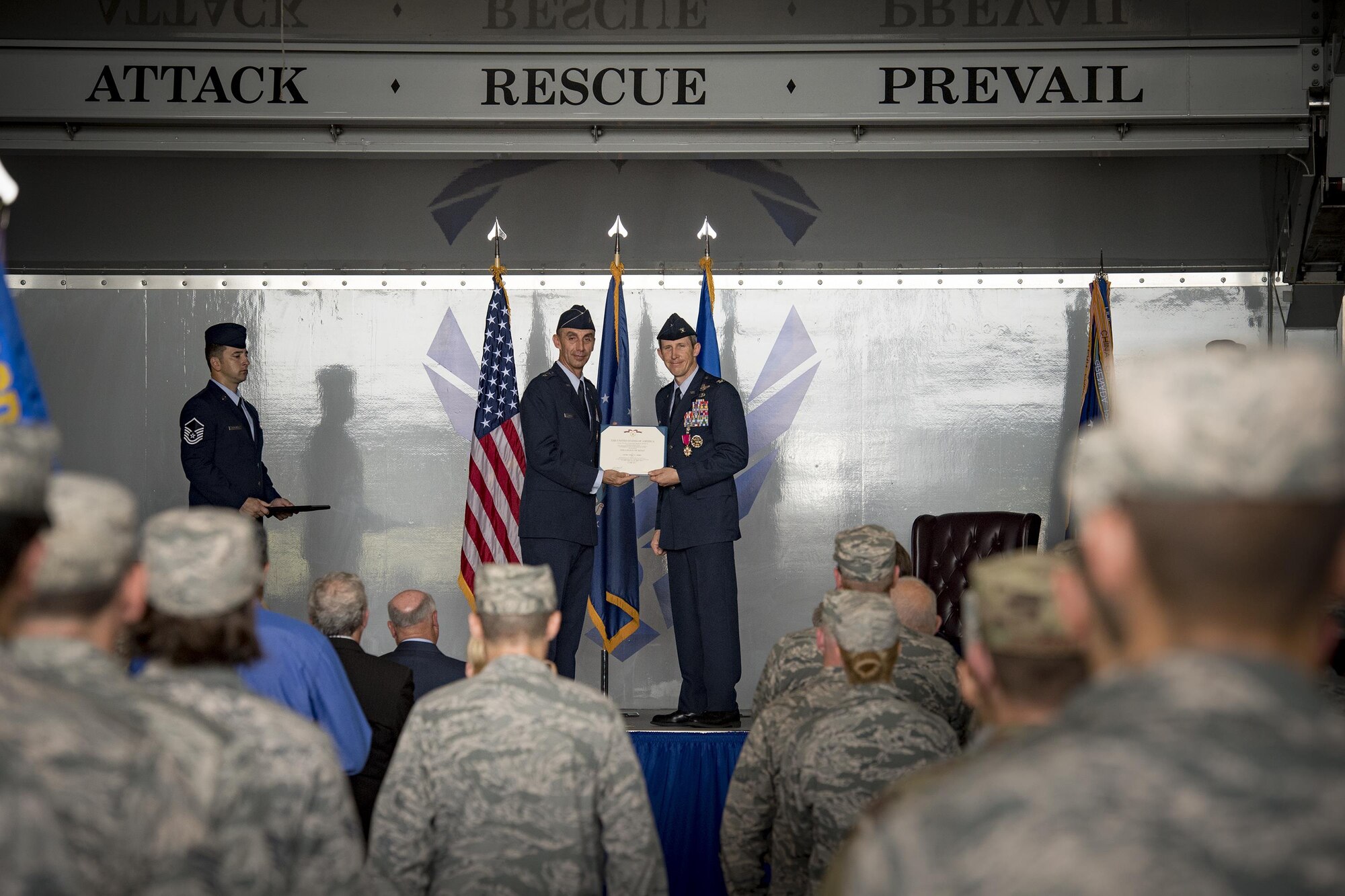 U.S. Air Force Maj. Gen. Scott J. Zobrist (left), 9th Air Force commander, presents the Legion of Merit award to Col. Thomas Kunkel, outgoing 23d Wing commander, during a change of command ceremony, July 10, 2017, at Moody Air Force Base, Ga. After giving up command of the 23d Wing, Kunkel will continue his career by serving as a Legislative Liaison at the Pentagon, Washington, D.C. (U.S. Air Force photo by Staff Sgt. Ryan Callaghan)
