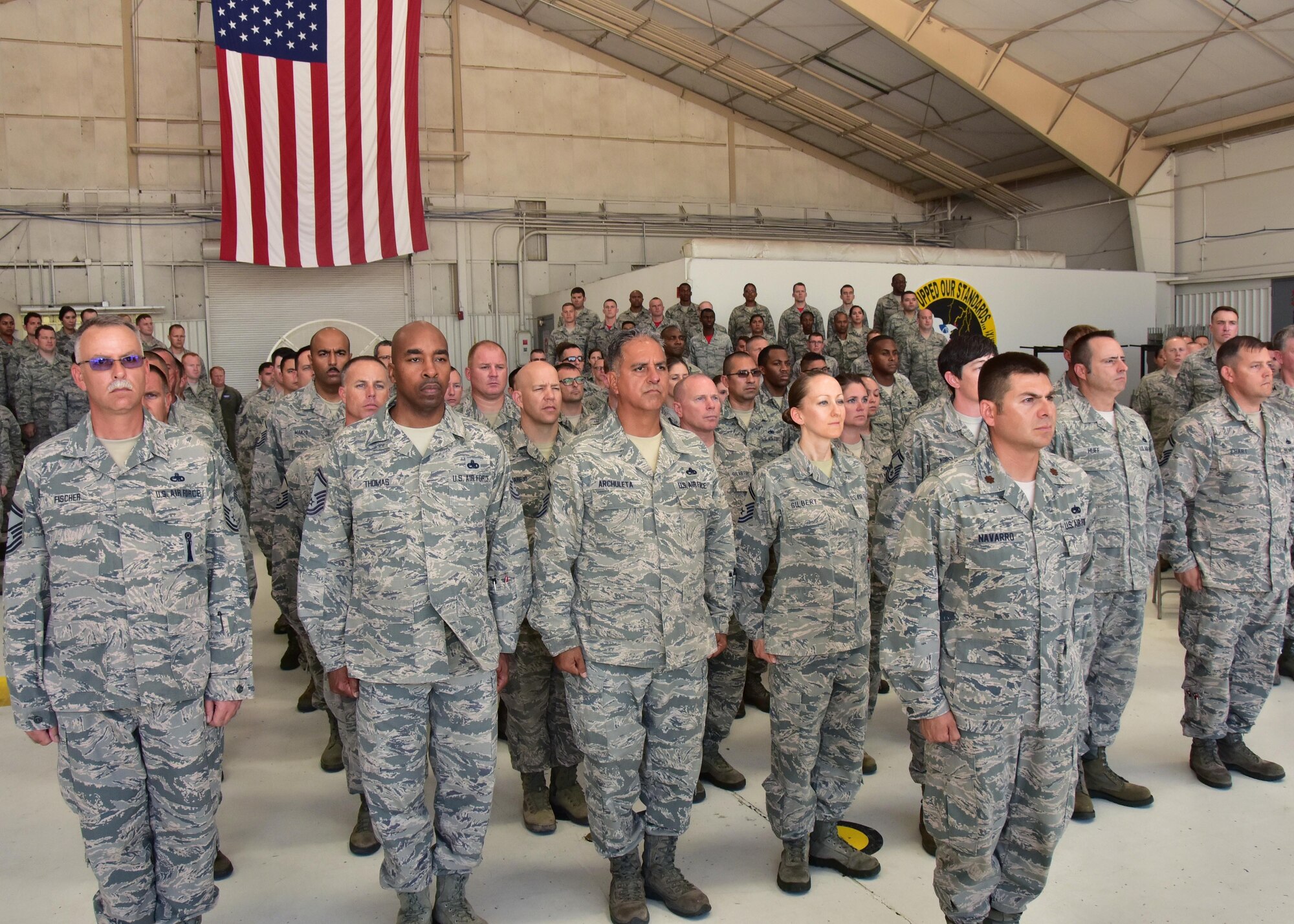 Airmen from the 924th Maintenance Squadron stand at attention July 9 during a change of command ceremony held on Davis-Monthan Air Force Base, Ariz. Lt. Col. Collin Shelton relinquished command to Maj. Bobby Cheek who took over as the new 924 MXS commander. Shelton’s new position and duty title will be the 924th Fighter Group deputy commander. Cheek has been with the 924th since May 2015 as the operations officer. Over 120 Airmen, family members, and guests attended the ceremony. (U.S. Air Force photo by Tech. Sgt. Louis Vega Jr.)