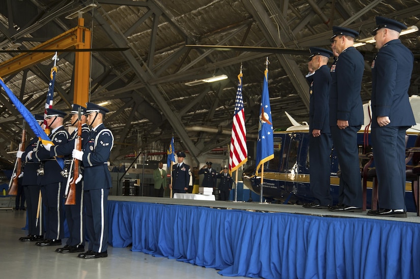 Members of the Joint Base Andrews Base Honor Guard display the colors during the 811th Operations Group change of command ceremony at Joint Base Andrews, Md., July 7, 2017. Col. Scott A. Grundahl relieved Col. Fred C. Koegler III as commander of the 811th OG. The group consists of the 811th Operations Support Squadron and the 1st Helicopter Squadron both of which provide the National Capital Region with continuous rotary-wing contingency response. (U.S. Air Force photo by Christopher Hurd)