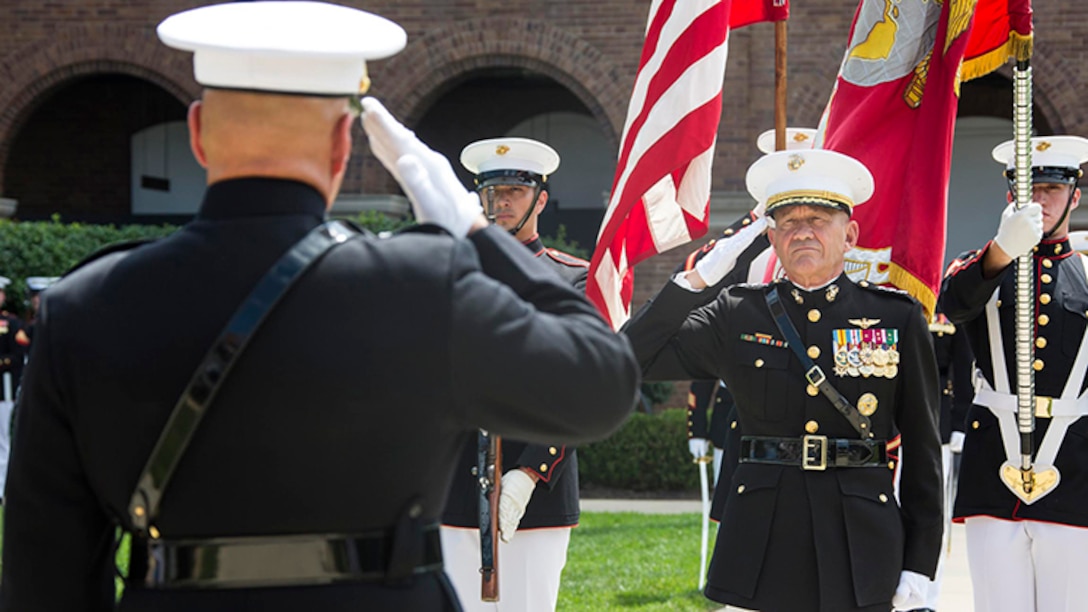 U.S. Marine Corps Lt. Gen. Jon M. Davis, deputy commandant, Aviation, salutes the flag during the playing of the national anthem during his retirement ceremony at Marine Barracks Washington, Washington, D.C., July 10, 2017. Davis retired after 37 years of service. 