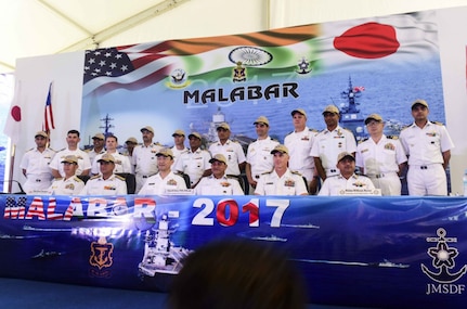 Leaders from U.S., Indian, and Japanese maritime forces pose for a photo after a press conference aboard the INS Jalashwa (LPD 41) as part of the opening ceremonies of exercise Malabar 2017. Malabar 2017 is the latest in a continuing series of exercises between the Indian Navy, Japan Maritime Self Defense Force and the U.S. Navy that has grown in scope and complexity over the years to address the variety of shared threats to maritime security in the Indo-Asia Pacific.