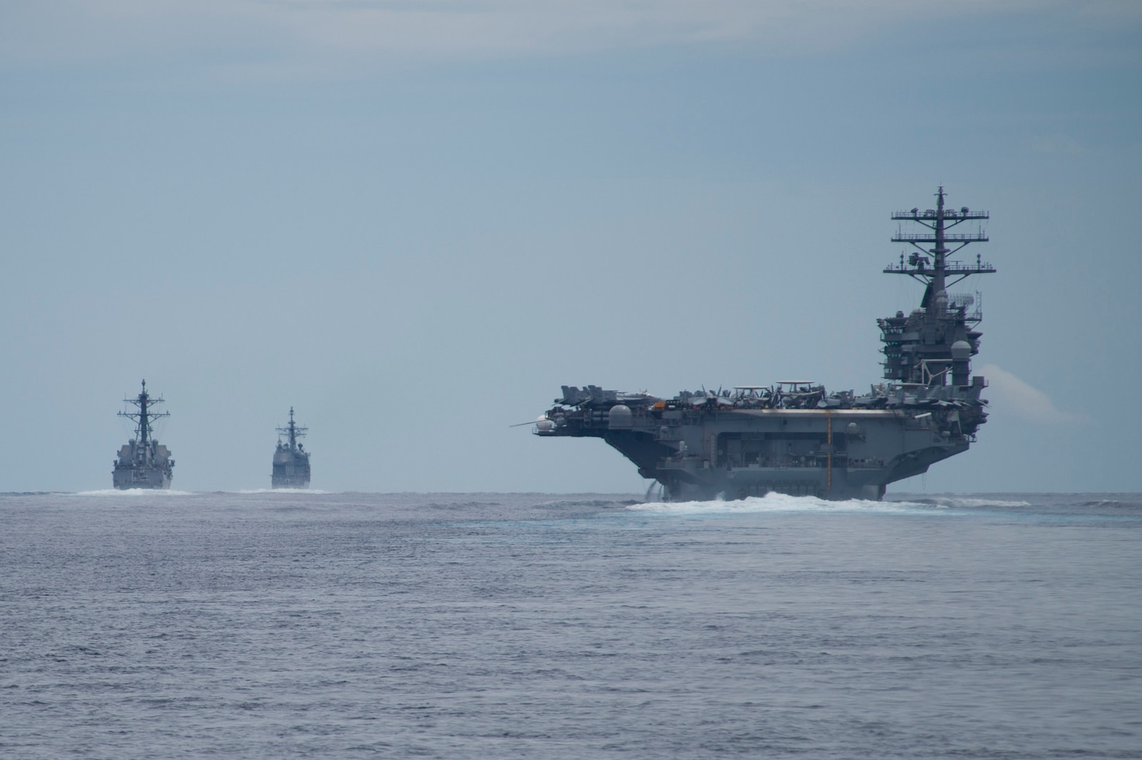 Ships assigned to the Nimitz Carrier Strike Group transit the Surigao Strait, July 3, 2017. The Nimitz Carrier Strike Group is currently deployed in the 7th fleet area of operations. The U.S. Navy has patrolled the Indo-Asia-Pacific routinely for more than 70 years promoting regional peace and security. 