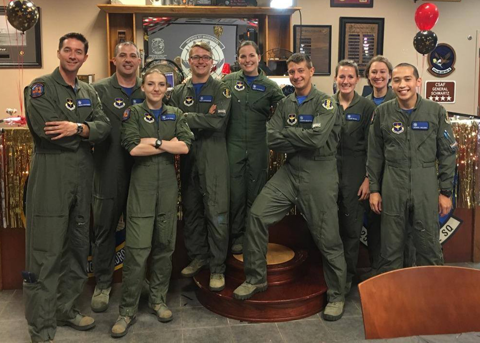 Graduating Air Battle Manager Class 17010 stands in the 337th Air Control Squadron Bullseye Lounge for a group photo. The nine graduates will move to combat ready air force squadrons to provide command and control mission execution as Air Battle Managers in a variety of weapons systems in support of air expeditionary forces worldwide. (Courtesy Photo)