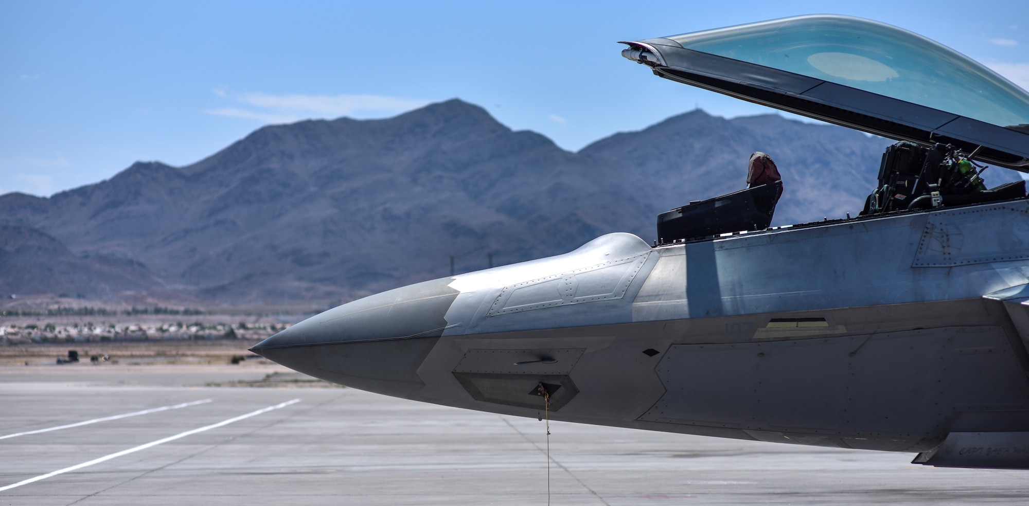 An F-22 Raptor from the 95th Fighter Squadron at Tyndall Air Force Base, Fla., is parked on the flightline at Nellis Air Force Base, Nev., in preparation for Red Flag 17-3 July 7, 2017. Red Flag is the U.S. Air Force's premier air-to-air combat training exercise. (U.S. Air Force photo by Senior Airman Dustin Mullen/Released)