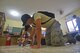 U.S. Air Force Senior Airman Alexis Munoz, structural repair maintainer with the 354th Civil Engineer Squadron (CES), Eielson Air Force Base, Alaska, left, and Airman 1st Class Justin Guerrero, structural repair maintainer with the 354th CES, Eielson AFB, Alaska, lay tile in a San Remigio elementary school classroom during Pacific Angel 2017 (PACANGEL) in Northern Cebu Province, Philippines, June 27, 2017. PACANGEL efforts help multilateral militaries in the Pacific improve and build relationships across a wide spectrum of civic engagements. (U.S. Air Force photo/Tech. Sgt. Jeff Andrejcik)