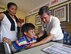 Dr. John Cinco, founder of Pacific Angel (PACANGEL), checks the vitals of a child from San Remigio during PACANGEL 2017 in Northern Cebu Province, Philippines, June 29, 2017. PACANGEL is a multilateral humanitarian assistance civil military engagement, which improves military-to-military partnerships in the Pacific while also providing medical health outreach, civic engineering projects and subject matter exchanges among partner forces. (U.S. Air Force photo/Master Sgt. Jeff Andrejcik)