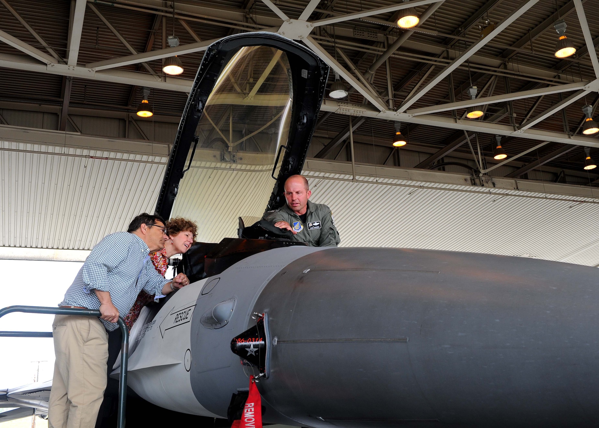 U.S. Air Force Col. Todd Robbins, the 354th Fighter Wing vice commander, explains features and functions in the F-16 Fighting Falcon cockpit to Congressman Gus Bilirakis and Congresswoman Susan Brooks July 7, 2017, on Eielson Air Force Base, Alaska. Seven House Committee of Energy and Commerce members visited the Arctic Region to learn about the energy resources and capabilities of the area. (U.S. Air Force photo by Staff Sgt. Jerilyn Quintanilla)