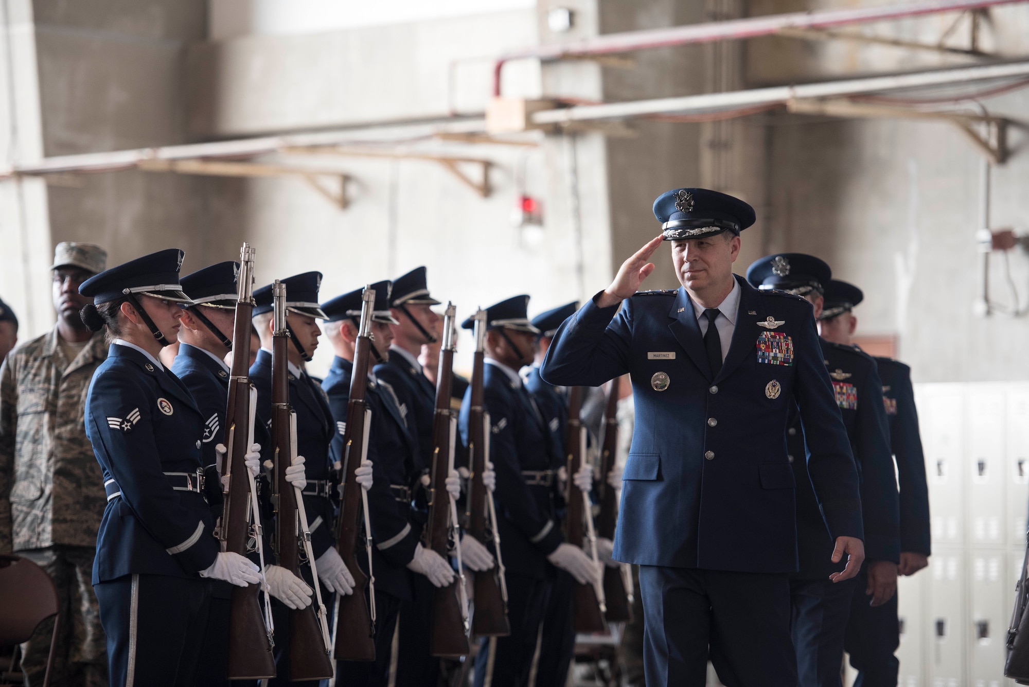 U.S. Air Force Lt. Gen. Jerry P. Martinez, U.S. Forces Japan and 5th Air Force commander, salutes Shogun Airmen during the 18th Wing change of command July 10, 2017 at Kadena Air Base, Japan. Martinez presided over the ceremony, transferring command from Brig. Gen. Barry Cornish to Brig. Gen. Case Cunningham. (U.S. Air Force photo by Senior Airman Omari Bernard)