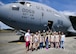 Members of the 446th Airlift Wing and a local Girl Scout troop pose in front of a C-17 Globemaster III at McChord Field July 9, 2017, during a tour of the base. During the visit, several girl scouts were able to tour the 446th AW, a C-17, control tower, and learned survival tips from a Survival, Evasion, Resistance and Escape, instructor. (U.S. Air Force photo by Tech. Sgt. Bryan Hull)