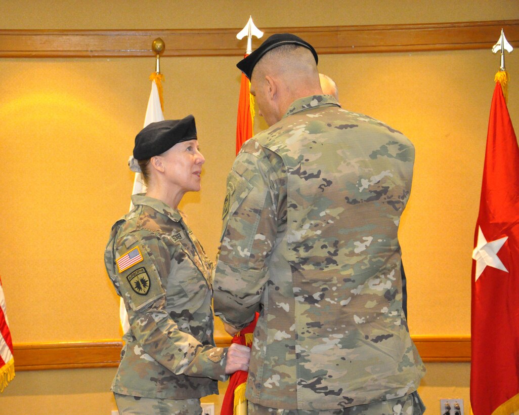 Brig. Gen. Peter B. Andrysiak, Commander of the U.S. Army Corps of Engineers, Pacific Ocean Division, passes the Engineer Colors to Col. Teresa Schlosser, Far East District commander, during a change of command ceremony on U.S. Army Garrison Yongsan, July 7.