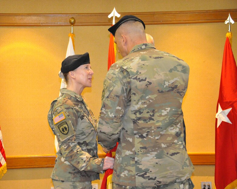 Brig. Gen. Peter B. Andrysiak, Commander of the U.S. Army Corps of Engineers, Pacific Ocean Division, passes the Engineer Colors to Col. Teresa Schlosser, Far East District commander, during a change of command ceremony on U.S. Army Garrison Yongsan, July 7.