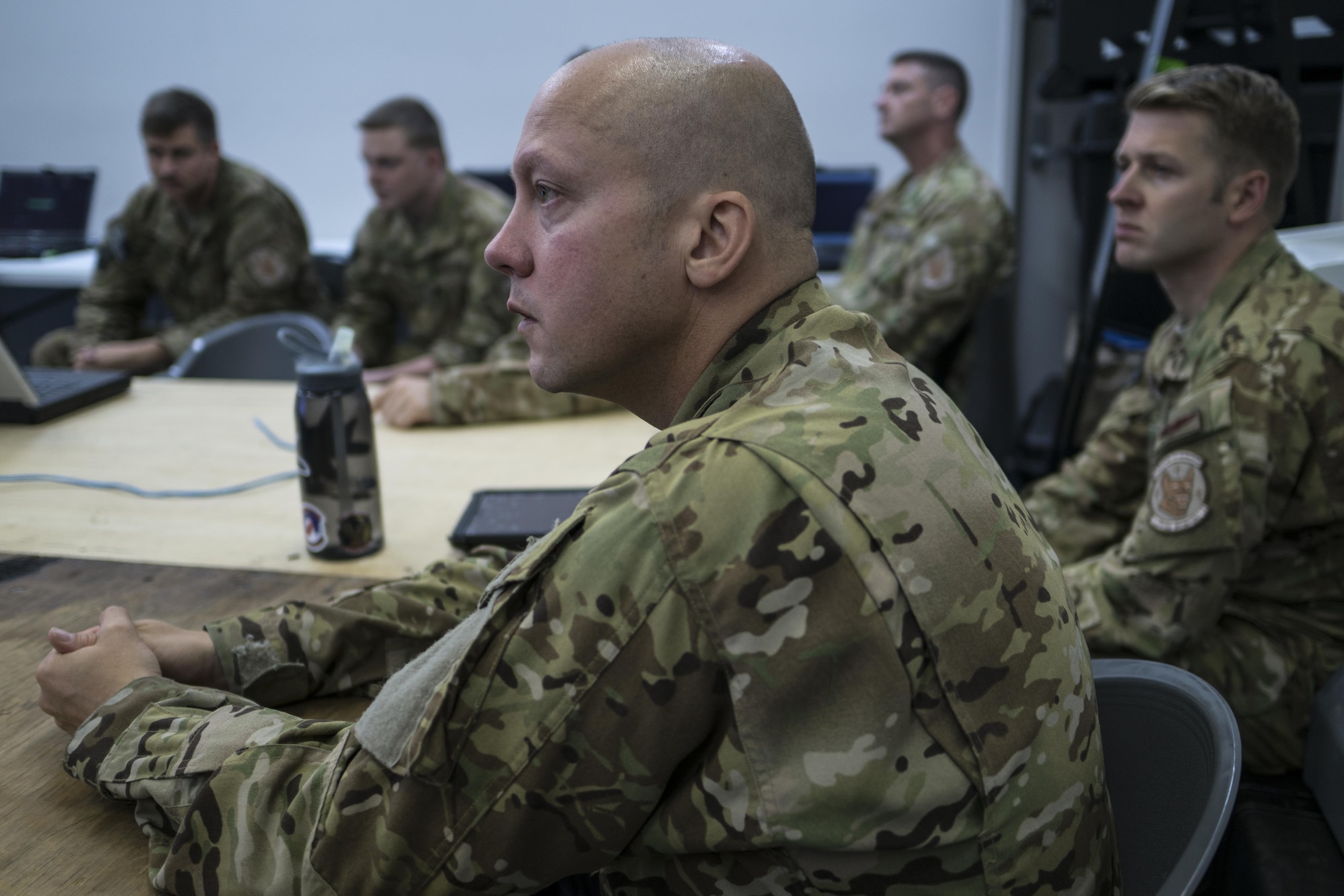 U.S. Air Force 17th Special Operations Squadron aircrew listen to the intelligence briefing provided by the 353rd Special Operations Group intelligence team July 9, 2017, at Rockhampton, Australia. The uniquely complex and challenging multinational environment provides realistic warfighting training for the special operations forces. (U.S. Air Force photo by Capt. Jessica Tait)