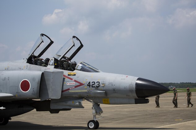 Japan Air Self-Defense Force (JASDF) pilots taxi an F-4 Phantom II at JASDF Hyakuri Air Base, Japan July 7, 2017. Marine Fighter Attack Squadron (VMFA) 232 is conducting exercises with the JASDF as part of the Aviation Training Relocation Program. The ATR is designed to increase operational readiness and bilateral interoperability between U.S. and Japanese forces. Throughout the exercise, VMFA-232 plans to enhance proficiency in dissimilar basic fighter maneuvers, section engaged maneuvers, active air defense and air interdiction, as well as conduct fighter attack instructor work-ups, and weapons and tactics instructor prerequisites. (U.S. Marine Corps photo by Lance Cpl. Mason Roy)