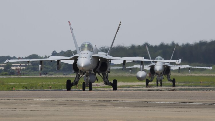 U.S. Marine Corps F/A-18C Hornets with Marine Fighter Attack Squadron (VMFA) 232, taxi after landing at Japan Air Self-Defense Force (JASDF) Hyakuri Air Base, Japan, July 7, 2017. VMFA-232 is conducting exercises with the JASDF as part of the Aviation Training Relocation (ATR) Program. This is the first time VMFA-232 arrived at JASDF Hyakuri Air Base, which gives the local Japanese forces the ability to simulate air-to-air maneuvers with an unfamiliar squadron. (U.S. Marine Corps photo by Lance Cpl. Mason Roy)