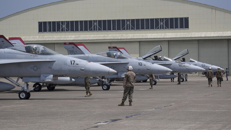 U.S. Marines with Marine Fighter Attack Squadron (VMFA) 232, taxi in F/A-18C Hornets at Japan Air Self-Defense Force (JASDF) Hyakuri Air Base, Japan, July 7, 2017. VMFA-232 is conducting exercises with the JASDF as part of the Aviation Training Relocation (ATR) Program. The ATR is designed to increase operational readiness and bilateral interoperability between U.S. and Japanese forces. (U.S. Marine Corps photo by Lance Cpl. Mason Roy)