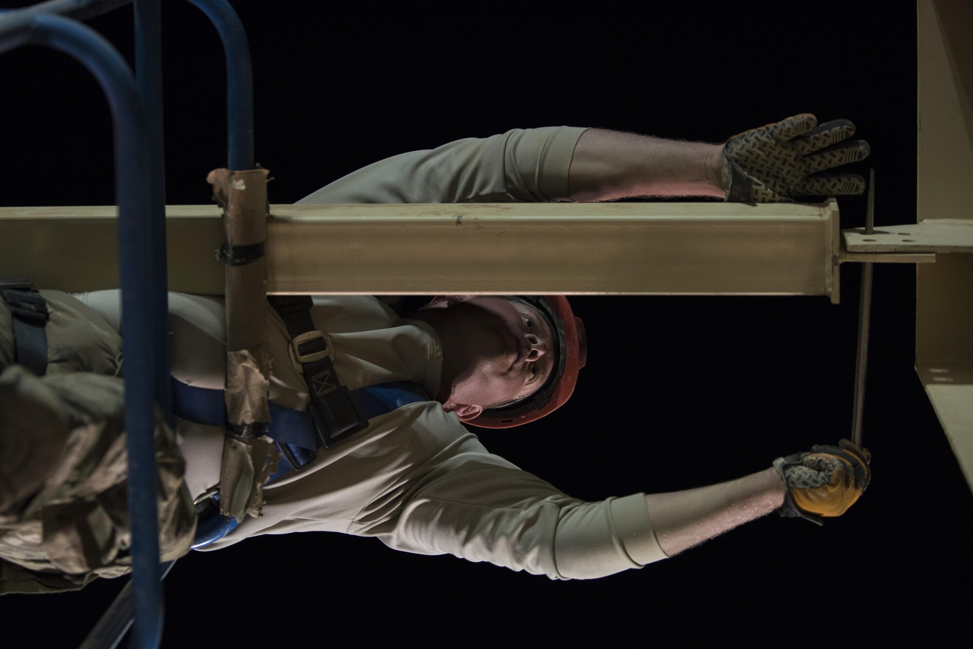 Staff Sgt. Shannon Beavin, 557th Expeditionary RED HORSE structural craftsman, aligns a building structure June 27, 2017, in Southwest Asia. The squadron provides engineering services throughout the Air Force Central Command area of responsibility, inside and outside the wire. (U.S. Air Force photo/Senior Airman Damon Kasberg)