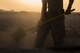 An Airman assigned to the 557th Expeditionary RED HORSE, shovels dirt and concrete away from a construction site June 27, 2017, in Southwest Asia. Working through extreme heat and high winds members of RED HORSE construct pre-engineered buildings vital to the expansion of the 332nd Air Expeditionary Wing and its operational capabilities. (U.S. Air Force photo/Senior Airman Damon Kasberg)