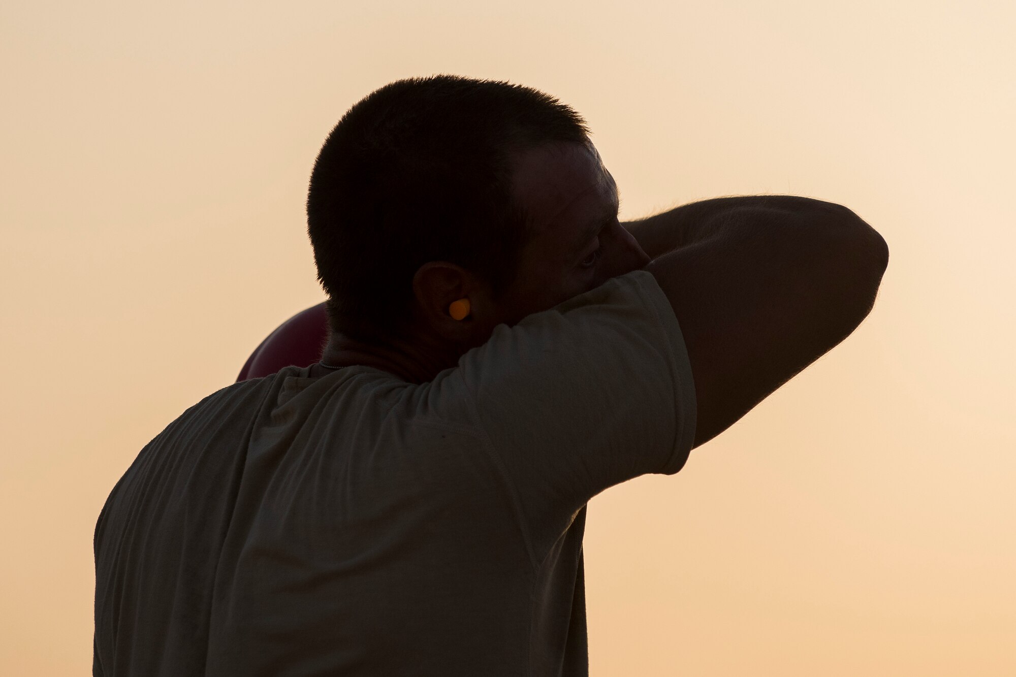 Staff Sgt. Jason Kaza, 557th Expeditionary RED HORSE structural craftsman, wipes sweat from his face June 27, 2017, in Southwest Asia. Working through extreme heat and high winds members of RED HORSE construct pre-engineered buildings vital to the expansion of the 332nd Air Expeditionary Wing and its operational capabilities. (U.S. Air Force photo/Senior Airman Damon Kasberg)