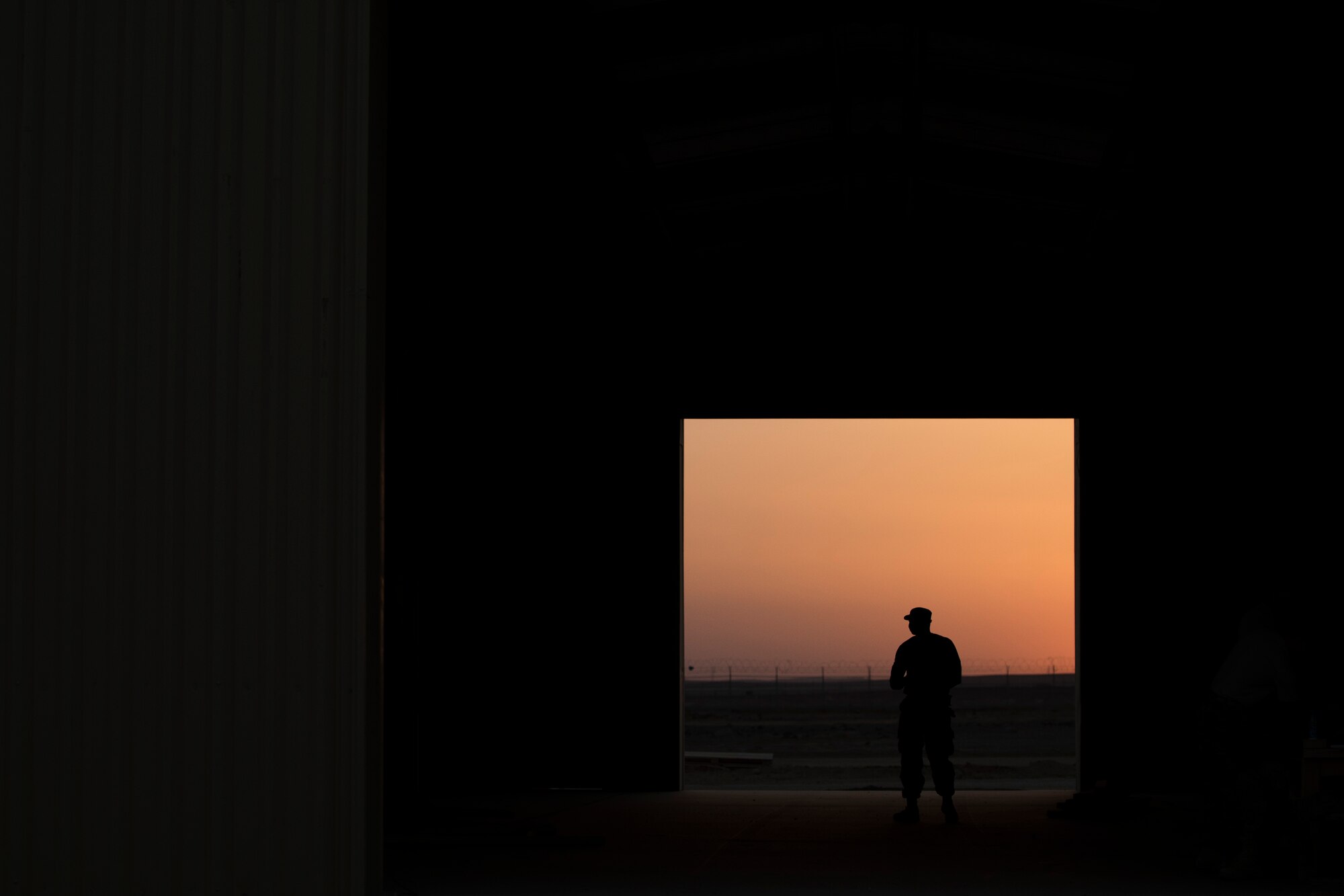 An Airman assigned to the 557th Expeditionary RED HORSE waits for the night shift to begin June 2017, in Southwest Asia. The squadron provides engineering services throughout the Air Force Central Command area of responsibility, inside and outside the wire. (U.S. Air Force photo/Senior Airman Damon Kasberg)