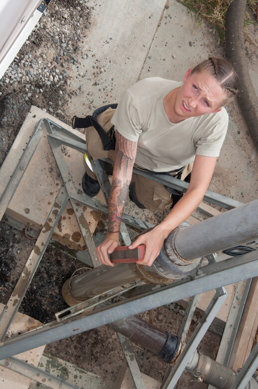 Senior Airman Ashley Eisenbarth opens a valve at the water fill station Sunday, June 25, 2017 at a 386th Air Expeditionary Wing fire station at an undisclosed location in Southwest Asia. Eisenbarth is deployed from Luke Air Force Base, Az. (U.S. Air Force photo by Master Sgt. Eric M. Sharman)