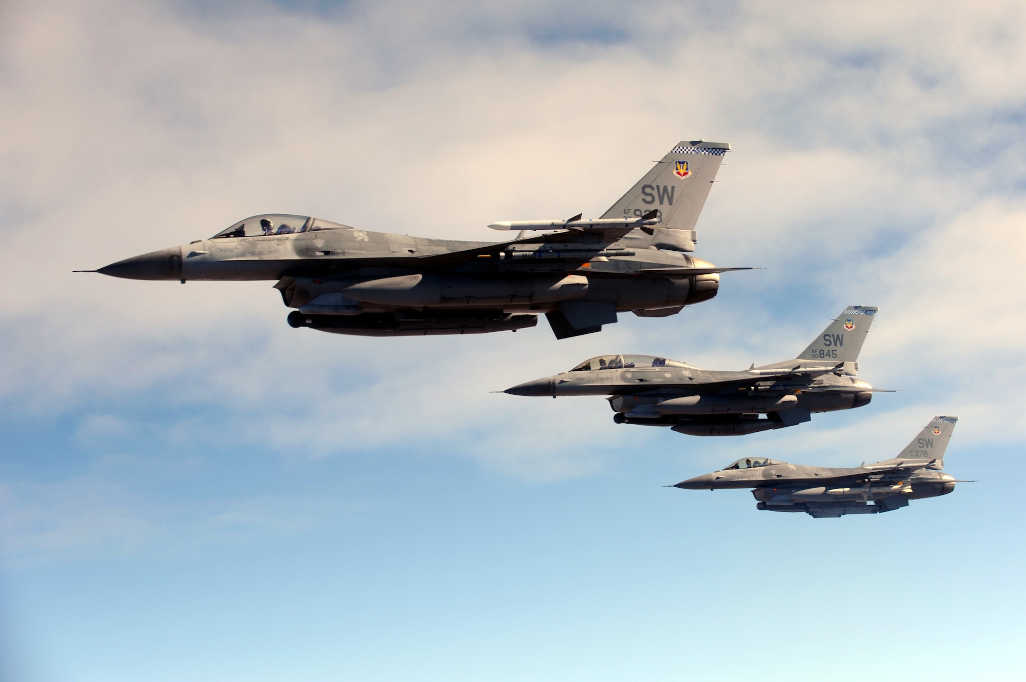 A three-ship formation of F-16CM Fighting Falcons assigned to Shaw Air Force Base, S.C., head out to the Nevada Test and Training Range for a Red Flag-Nellis 10-1 mission, in Nevada, October 2009. Team Shaw members, including maintainers, intelligence Airmen and pilots, participate in Red Flag exercises multiple times a year to maintain their combat readiness. (Courtesy Photo)