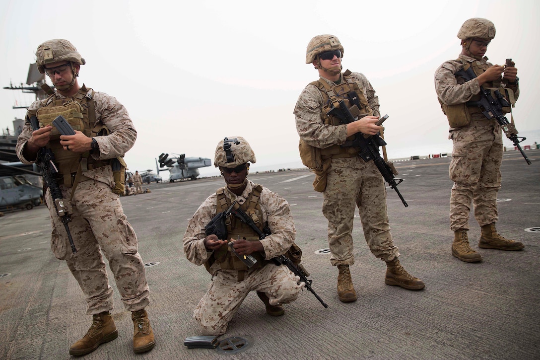 Marines load their magazines before participating in a deck shoot aboard the amphibious assault ship USS Bataan in the Gulf of Aden, July 3, 2017. The Marines are assigned to 3rd Battalion, 6th Marine Regiment. Marine Corps photo by Cpl. Brianna Gaudi