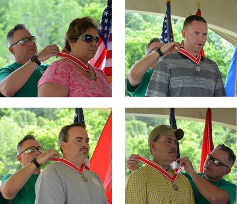 At the annual Organization Day Picnic and Awards Ceremony Colonel Secrist awarded the Steel De Fluery Medal to Sekia M. Dalton, Brandon Scott, John Johnson and Ronald S. Payne for their outstanding contributions to the Huntington District and the Engineer Regiment.