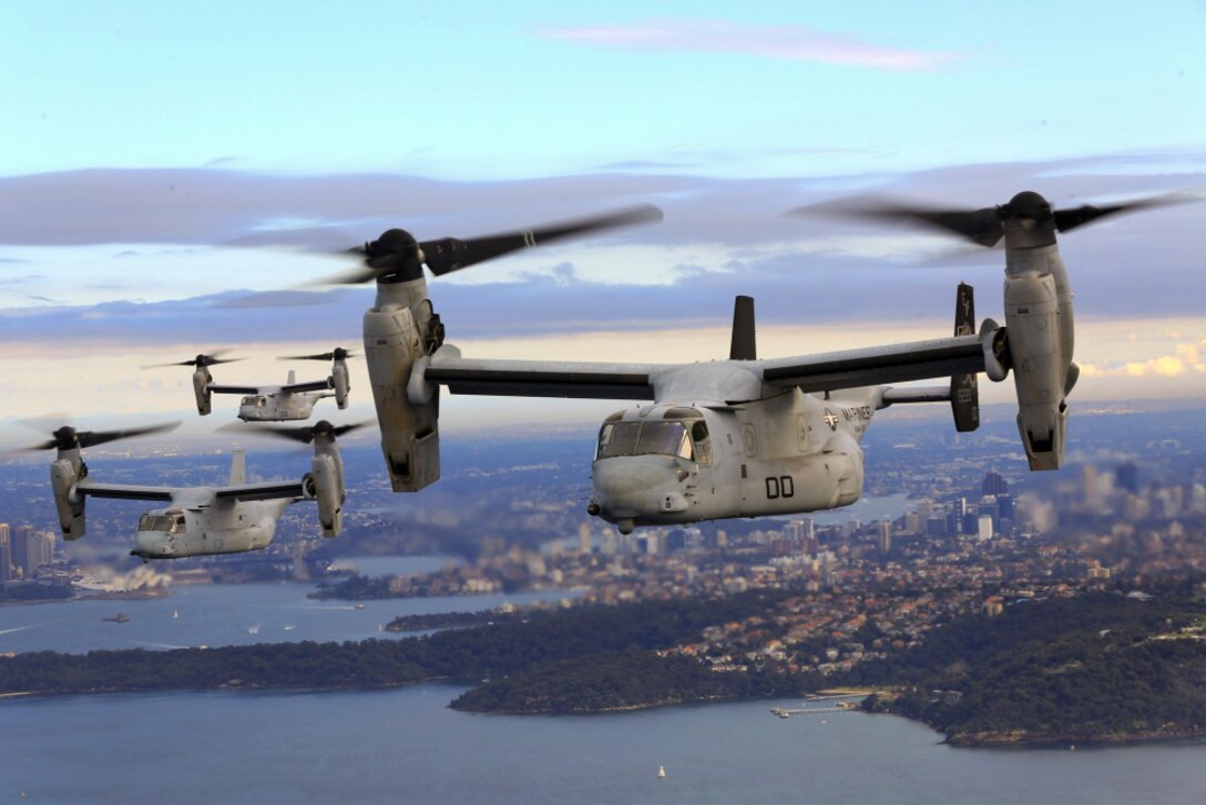 A group of MV-22B Osprey tiltrotor aircraft fly in formation above Sydney Harbor in Australia, June 29, 2017. The MV-22Bs belong to Marine Medium Tiltrotor Squadron 265.  Marine Corps photo by Staff Sgt. T. T. Parish