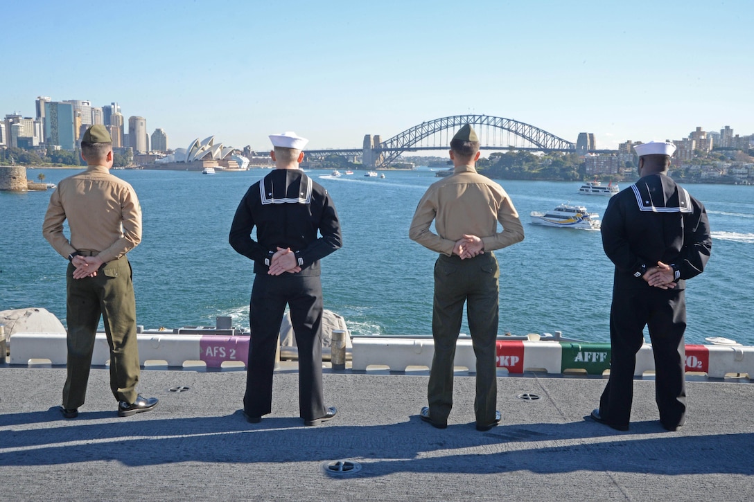 Sailors and Marines man the rails as the amphibious assault ship USS Bonhomme Richard pulls into Sydney Harbor as part of a port visit to Australia, June 29, 2017. The Bonhomme Richard was in Sydney to advance bilateral relations ahead of the training exercise Talisman Saber 17. Navy photo by Petty Officer 2nd Class Sarah Villegas