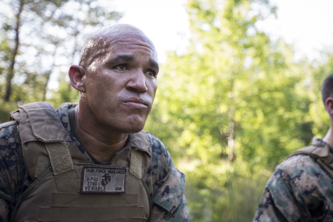 Master Gunnery Sgt. Melvin Venable watches intently as Marines practice martial arts skills necessary to become a Martial Arts Insturctor Trainer.  Venerable says he is taking the class in order to be able to better train the Marines under his command.