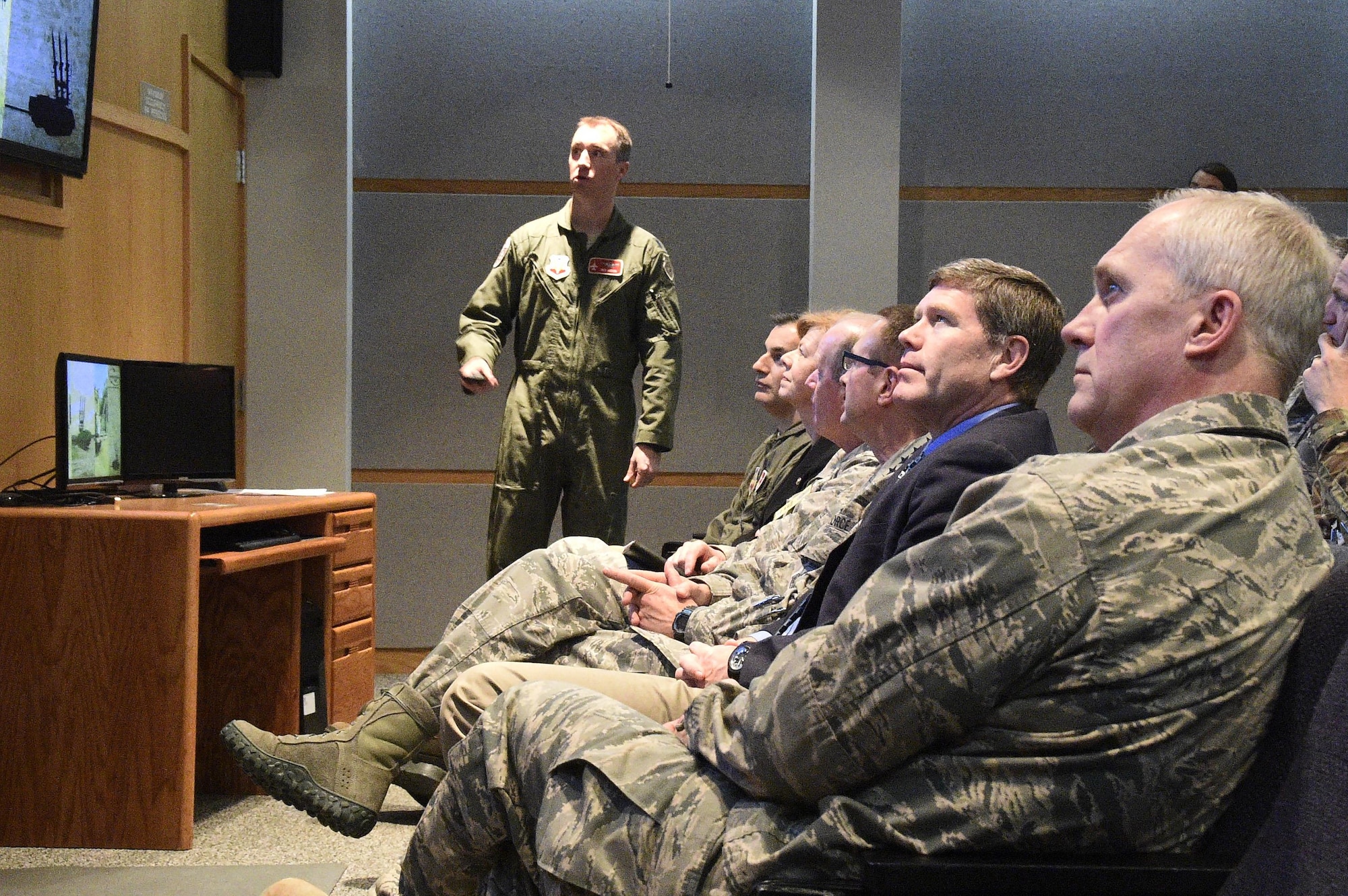Lt. Col. Ben Gerds briefs distinguished visitors — including Gen. Joseph Lengyel, chief of the National Guard Bureau; U.S. Sen. Tammy Baldwin; and U.S. Rep. Ron Kind — during a May 5 visit to Volk Field Combat Readiness Training Center to observe Northern Lightning, an annual counterland training exercise that began May 1 and will end May 12. The exercise will involve aircraft and personnel from multiple active duty Air Force, National Guard and Navy. Northern Lightning is one of seven Air National Guard joint accredited exercises held at a Combat Readiness Training Center. The two-week long exercise will provide participating units a tactical level, joint training environment emphasizing user-defined objectives. Wisconsin Department of Military Affairs photo by Vaughn R. Larson