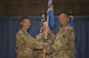 Col. Christopher K. Fuller, 332nd Expeditionary Mission Support Group commander, left, passes the guidon to Maj. Matthew W. Tronnes, during the 332nd Expeditionary Civil Engineer Squadron change of command ceremony July 10, 2017, in Southwest Asia. The passing of a guidon symbolizes a unit’s transfer of command. (U.S. Air Force photo/Senior Airman Damon Kasberg)