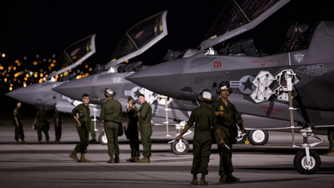 Marines with Marine Fighter Attack Squadron 211 “Wake Island Avengers,” 3rd Marine Aircraft Wing, wait for pilots to walk to three F-35B Lightning IIs on the first day of Red Flag 17-3 at Nellis Air Force Base, Nev., July 10. Red Flag 17-3 is a realistic combat training exercise involving the U.S. Air Force, Army, Navy and Marine Corps and this iteration is the first to have both the Air Force’s F-35A Lightning II and the Marine Corps’ F-35B Lightning II, which is capable of short takeoff vertical landing.