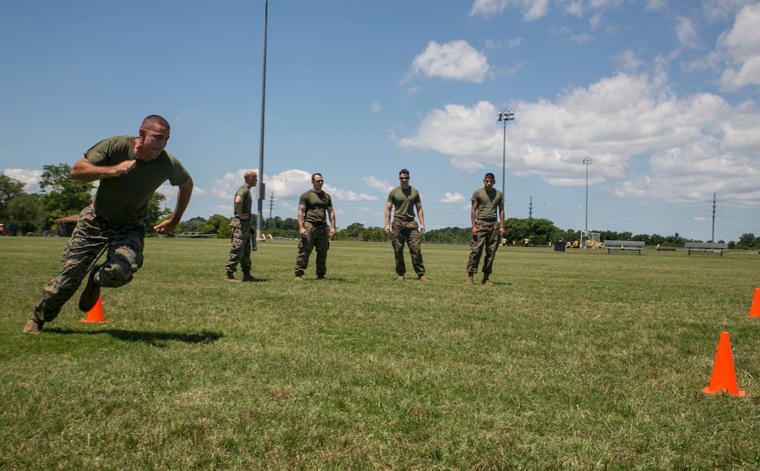 Staff Sgt. William Hobson, operations chief, G-1, U.S. Marine Corps Forces Command, sprints through the L-shaped, cone drill as part of the High Intensity Tactical Training preliminary competition at Captain Slade Cutter Park, Norfolk, Va., June 28. The competition is an annual event in which Marines compete for a shot at competing in San Diego at the national competition. (Official U.S. Marine Corps photo by Cpl. Logan Snyder/ Released)