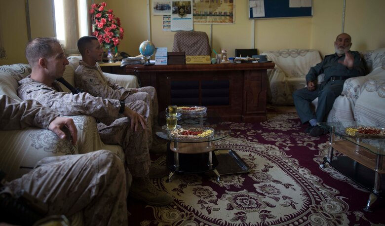 A U.S. Marine advisor with Task Force Southwest acquires information from his counterpart during a train, advise and assist mission at the Helmand Provincial Police Headquarters in Lashkar Gah, Afghanistan, July 9, 2017. This mission provided an opportunity for advisors to meet with their counterparts, review the security posture at the PHQ and ensure that Afghan National Defense and Security Forces have an effective defense of Lashkar Gah. (U.S. Marine Corps photo by Sgt. Justin T. Updegraff)