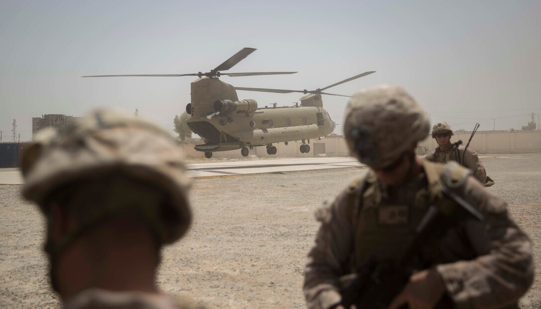 A Ch-47 Chinook lands to transport U.S. Marine advisors with Task Force Southwest after a train, advise and assist mission at the Helmand Provincial Police Headquarters in Lashkar Gah, Afghanistan, July 9, 2017. This mission provided an opportunity for advisors to meet with their counterparts, review the security posture at the PHQ and ensure that Afghan National Defense and Security Forces have an effective defense of Lashkar Gah. (U.S. Marine Corps photo by Sgt. Justin T. Updegraff)