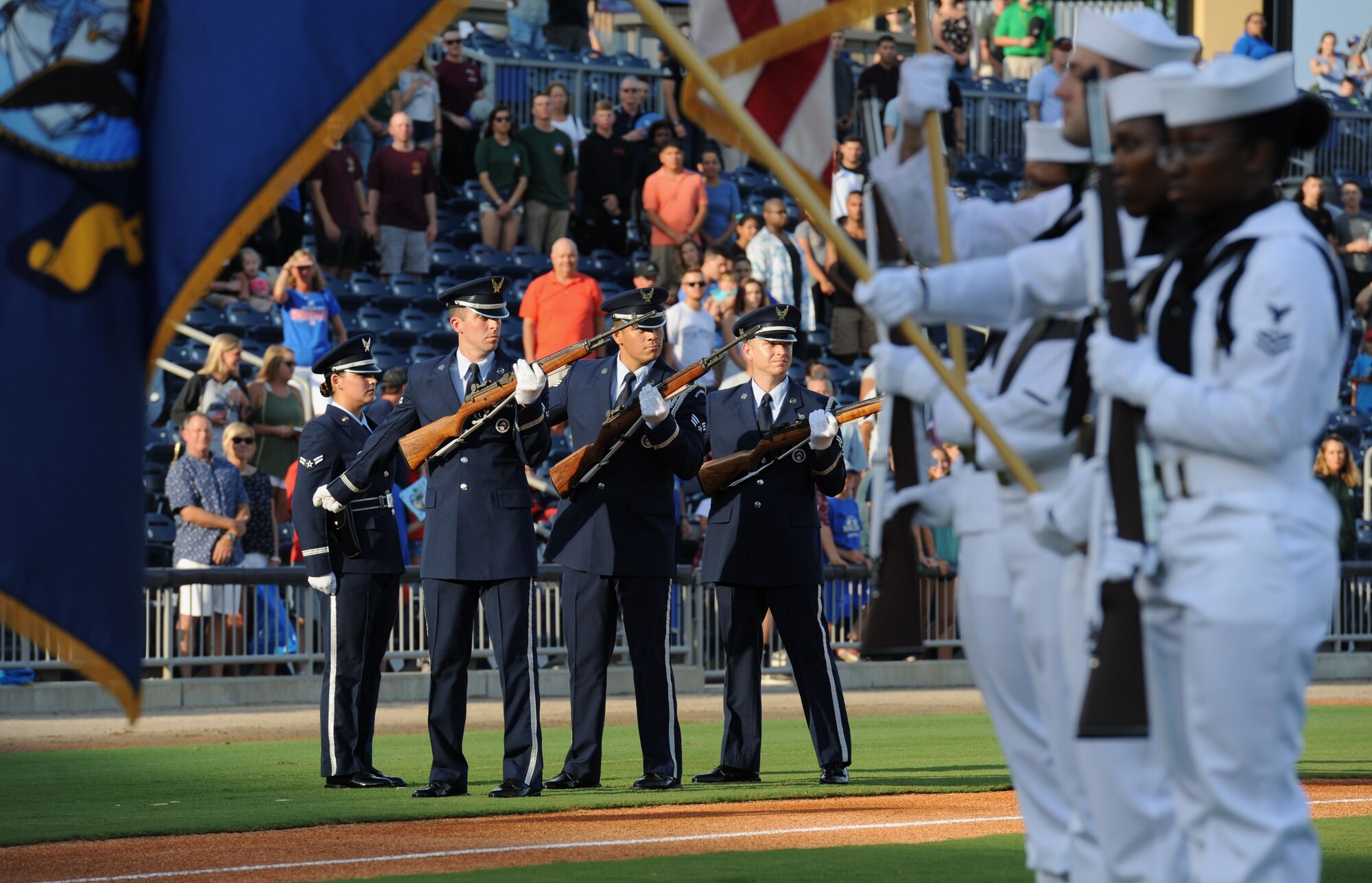 Keesler Air Force Base Honor Guard members perform a firing party during the Biloxi Shuckers Minor League Baseball team’s military appreciation night July 8, 2017, in Biloxi, Miss. The Shuckers recognized and honored service members and their families for the dedication, commitment and sacrifices they make for the nation. (U.S. Air Force photo by Kemberly Groue)
