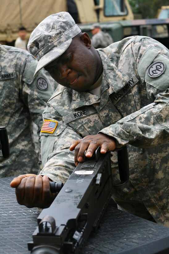 Army Spc. Yacouba Kone performs a function check on an M2 .50-caliber machine gun while preparing for exercise Talisman Saber at the Shoalwater Bay training area in Queensland, Australia, July 10, 2017. Kone is assigned to the New York Army National Guard’s Company F, 427th Brigade Support Battalion, 27th Infantry Brigade Combat Team. Army National Guard photo by Sgt. Alexander Rector