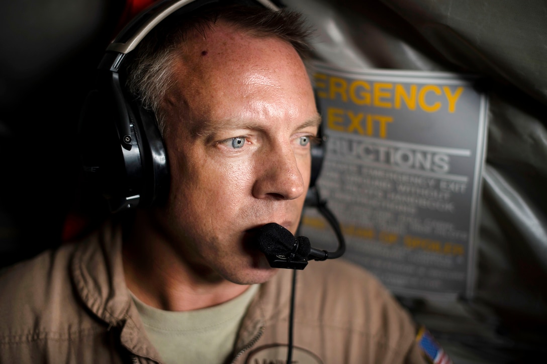 An Air Force pilot communicates with his KC-135 Stratotanker crew during a flight supporting Operation Inherent Resolve in an undisclosed location, July 6, 2017. Air Force photo by Staff Sgt. Trevor T. McBride