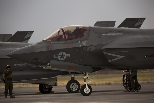 A pilot with Marine Fighter Attack Squadron (VMFA) 211 “Wake Island Avengers,” 3rd Marine Aircraft Wing, conducts the preflight inspection of an F-35B Lightning II on the first day of Red Flag 17-3 at Nellis Air Force Base, Nev., July 10. Red Flag 17-3 is a realistic combat training exercise involving the U.S. Air Force, Army, Navy and Marine Corps and this iteration is the first to have both the Air Force’s F-35A Lightning II and the Marine Corps’ F-35B Lightning II, which is capable of short takeoff vertical landing (STOVL). (U.S. Marine Corps photo by Sgt. Lillian Stephens/Released)