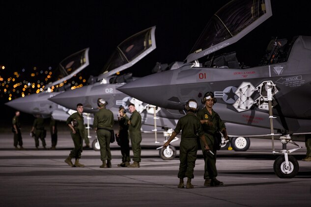 Marines with Marine Fighter Attack Squadron (VMFA) 211 “Wake Island Avengers,” 3rd Marine Aircraft Wing, wait for pilots to walk to three F-35B Lightning IIs on the first day of Red Flag 17-3 at Nellis Air Force Base, Nev., July 10. Red Flag 17-3 is a realistic combat training exercise involving the U.S. Air Force, Army, Navy and Marine Corps and this iteration is the first to have both the Air Force’s F-35A Lightning II and the Marine Corps’ F-35B Lightning II, which is capable of short takeoff vertical landing (STOVL). (U.S. Marine Corps photo by Sgt. Lillian Stephens/Released)