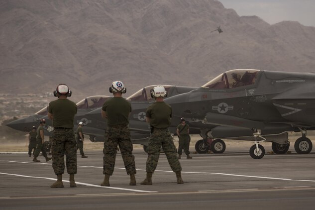 Marines with Marine Fighter Attack Squadron (VMFA) 211 “Wake Island Avengers,” 3rd Marine Aircraft Wing, stand by as a pilot conducts preflight checks in an F-35B Lightning II on the first day of Red Flag 17-3 at Nellis Air Force Base, Nev., July 10. Red Flag 17-3 is a realistic combat training exercise involving the U.S. Air Force, Army, Navy and Marine Corps and this iteration is the first to have both the Air Force’s F-35A Lightning II and the Marine Corps’ F-35B Lightning II, which is capable of short takeoff vertical landing (STOVL). (U.S. Marine Corps photo by Sgt. Lillian Stephens/Released)